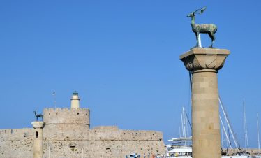 legendary Colossus of Rhodes and the iconic deer statues